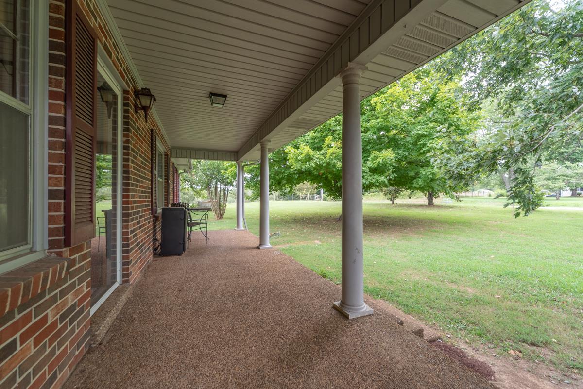 6246 Arno Road Franklin, TN 37064 - Photo 3 of 29 a view of a porch with furniture and a yard