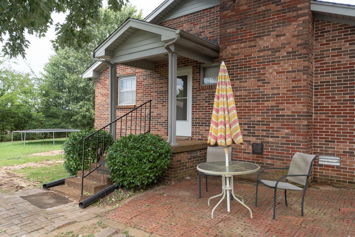 6246 Arno Road Franklin, TN 37064 - Photo 23 of 29 a patio with table and chairs and potted plants