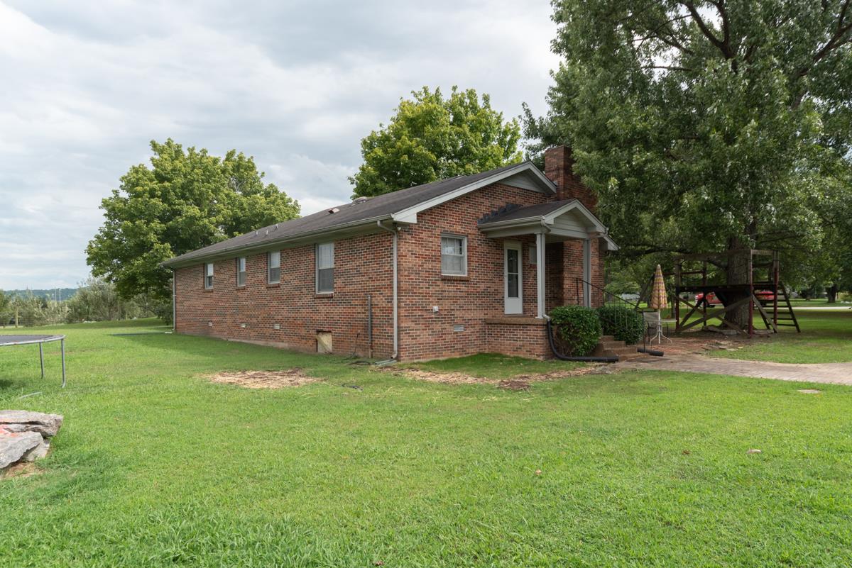 6246 Arno Road Franklin, TN 37064 - Photo 24 of 29 a front view of a house with garden