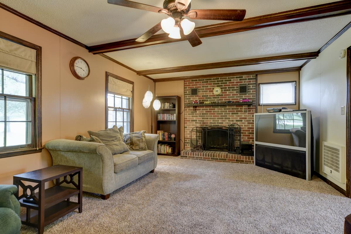 6246 Arno Road Franklin, TN 37064 - Photo 4 of 29 a living room with furniture and a fireplace