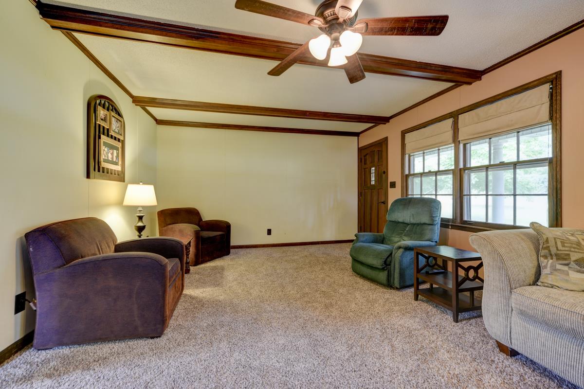 6246 Arno Road Franklin, TN 37064 - Photo 7 of 29 a living room with furniture a ceiling fan and a window