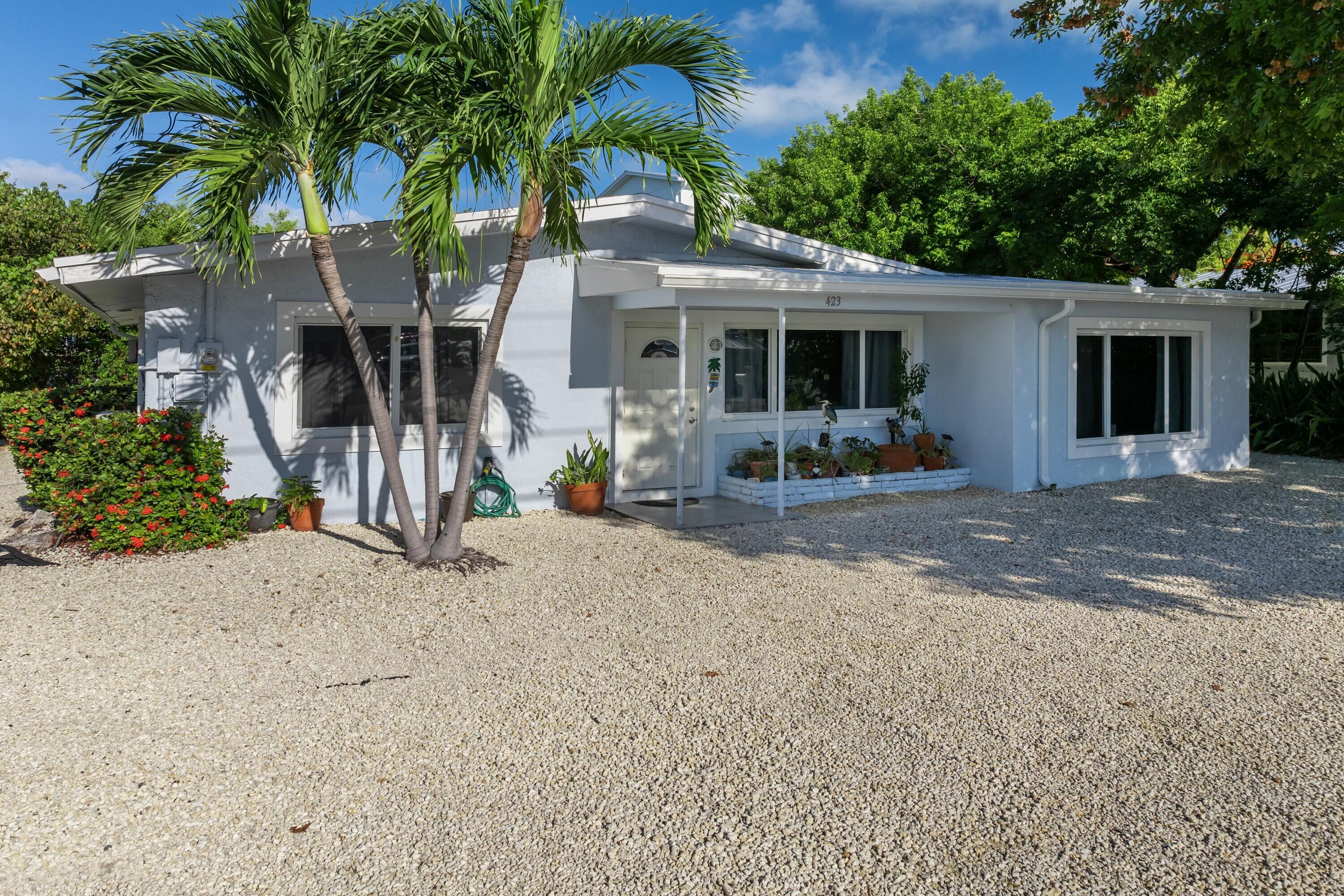423 80th Street Marathon, FL 33050 - Photo 1 of 39 a view of a house with backyard and sitting area