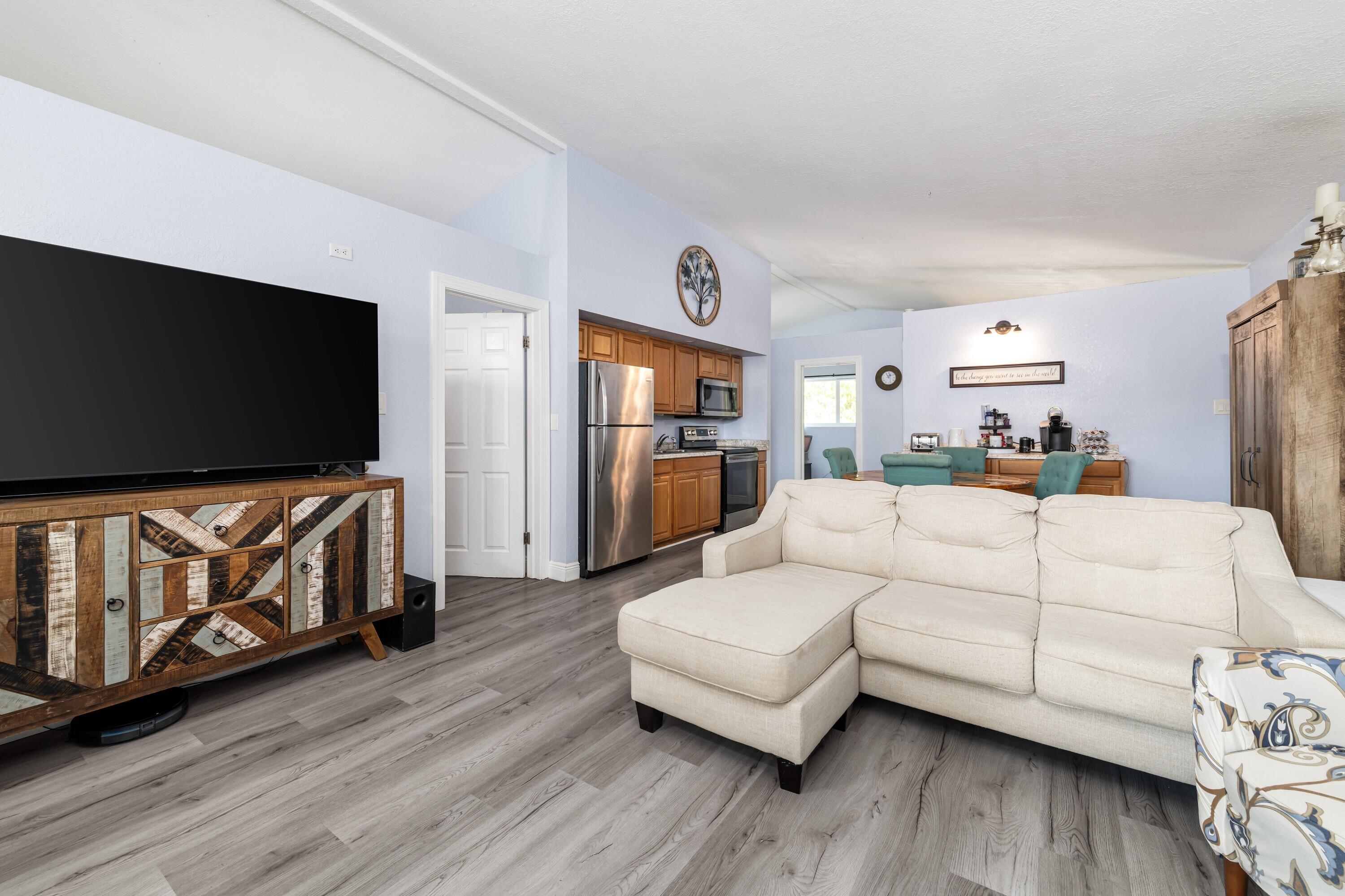 423 80th Street Marathon, FL 33050 - Photo 12 of 39 a living room with furniture and a flat screen tv