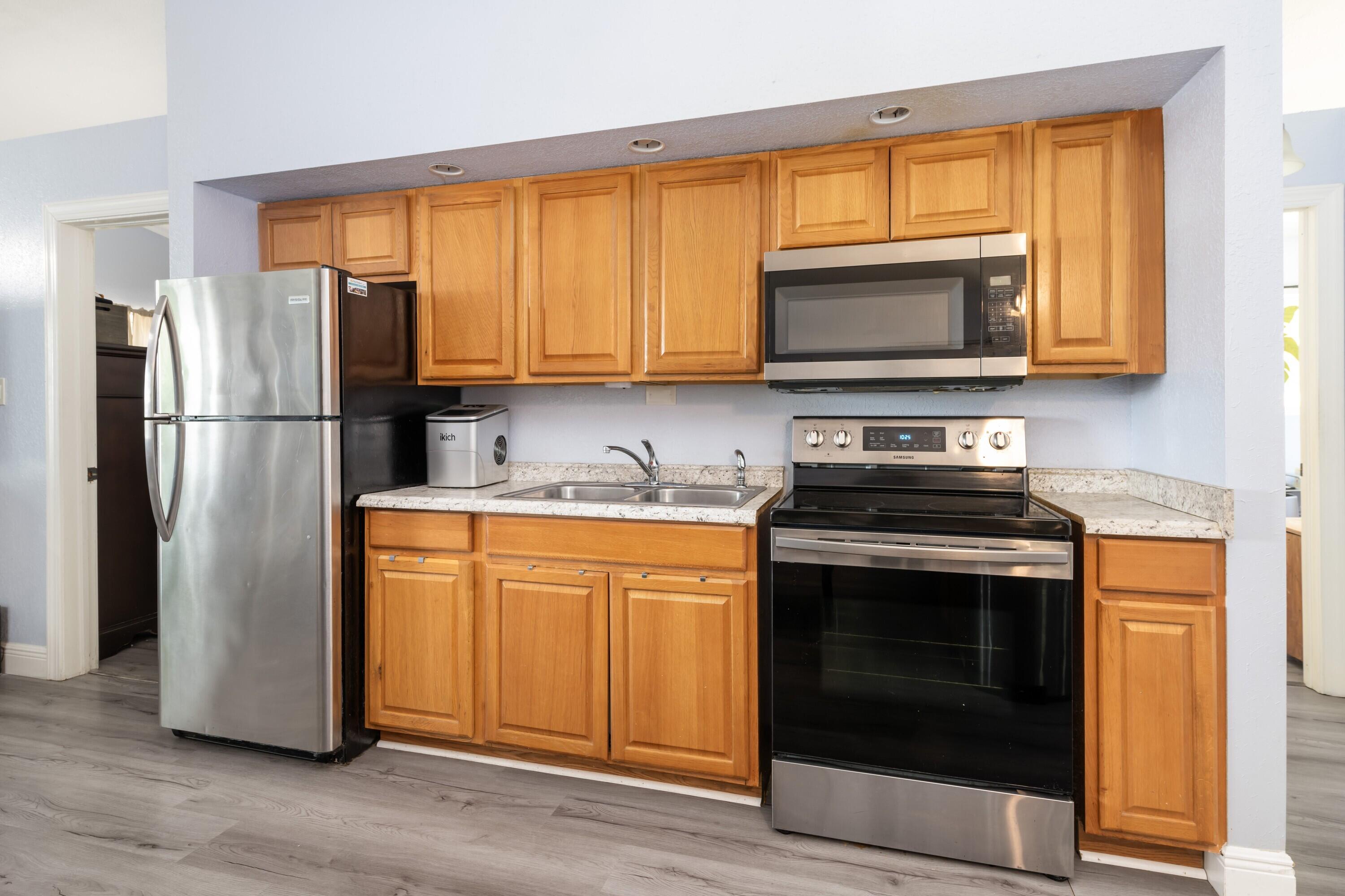 423 80th Street Marathon, FL 33050 - Photo 15 of 39 a kitchen with appliances a sink and a window