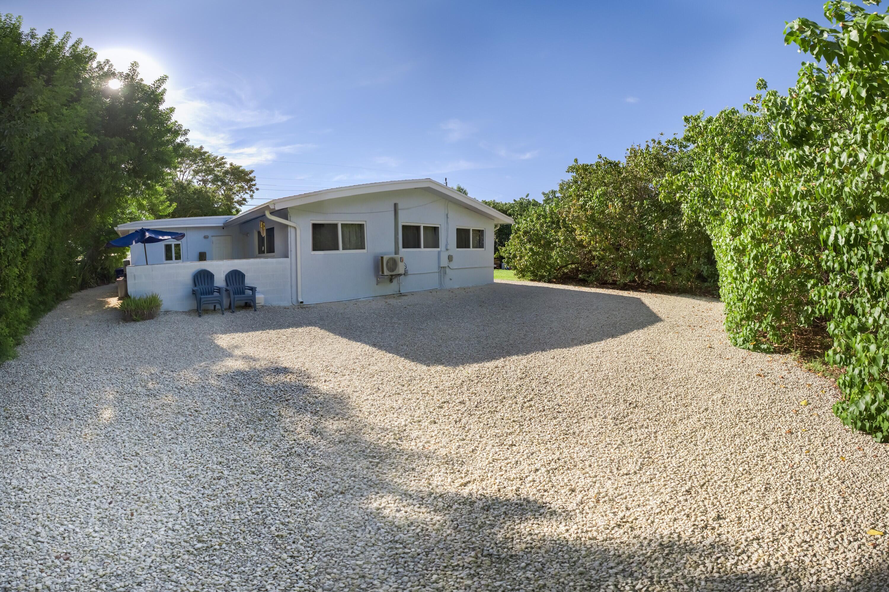 423 80th Street Marathon, FL 33050 - Photo 2 of 39 a front view of a house with a yard