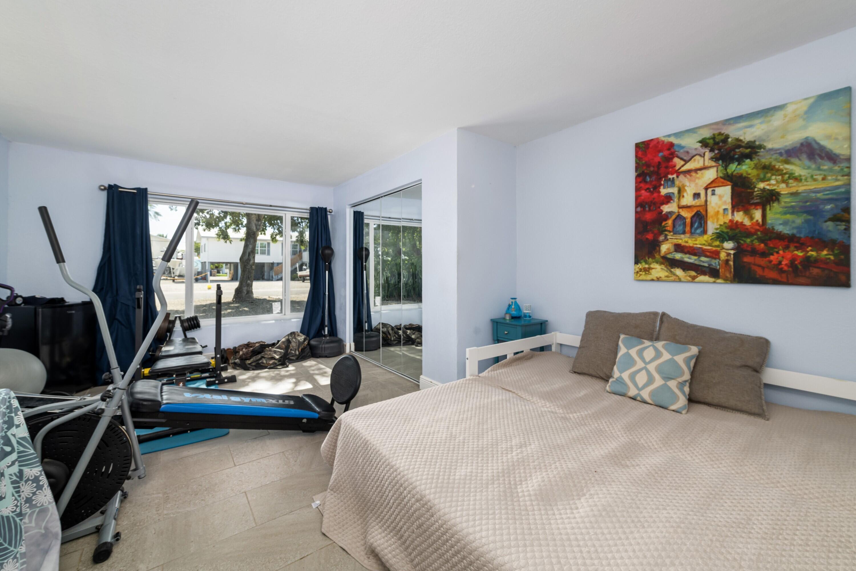 423 80th Street Marathon, FL 33050 - Photo 23 of 39 a bedroom with furniture and a large window