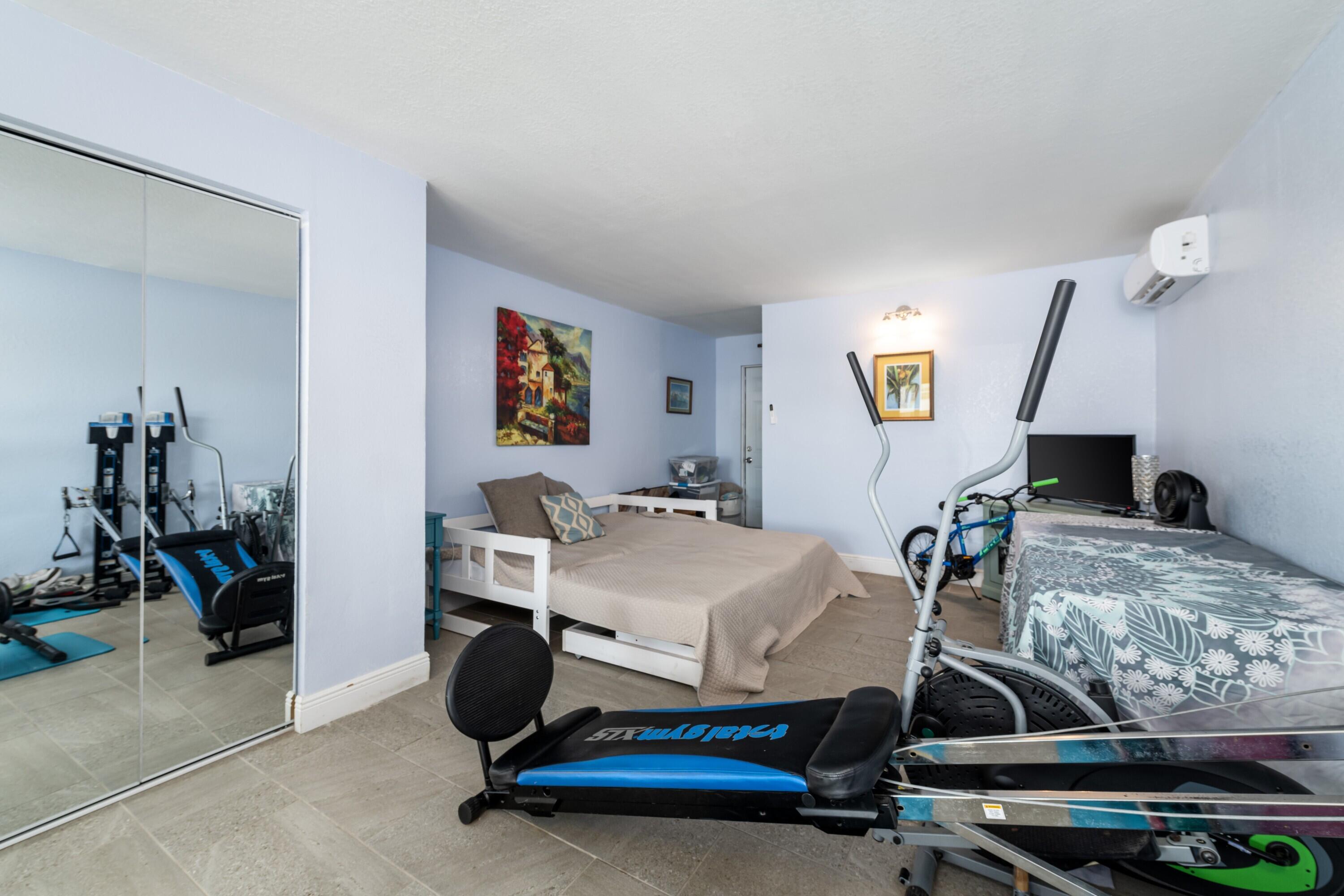 423 80th Street Marathon, FL 33050 - Photo 24 of 39 a bedroom with bed and a desk