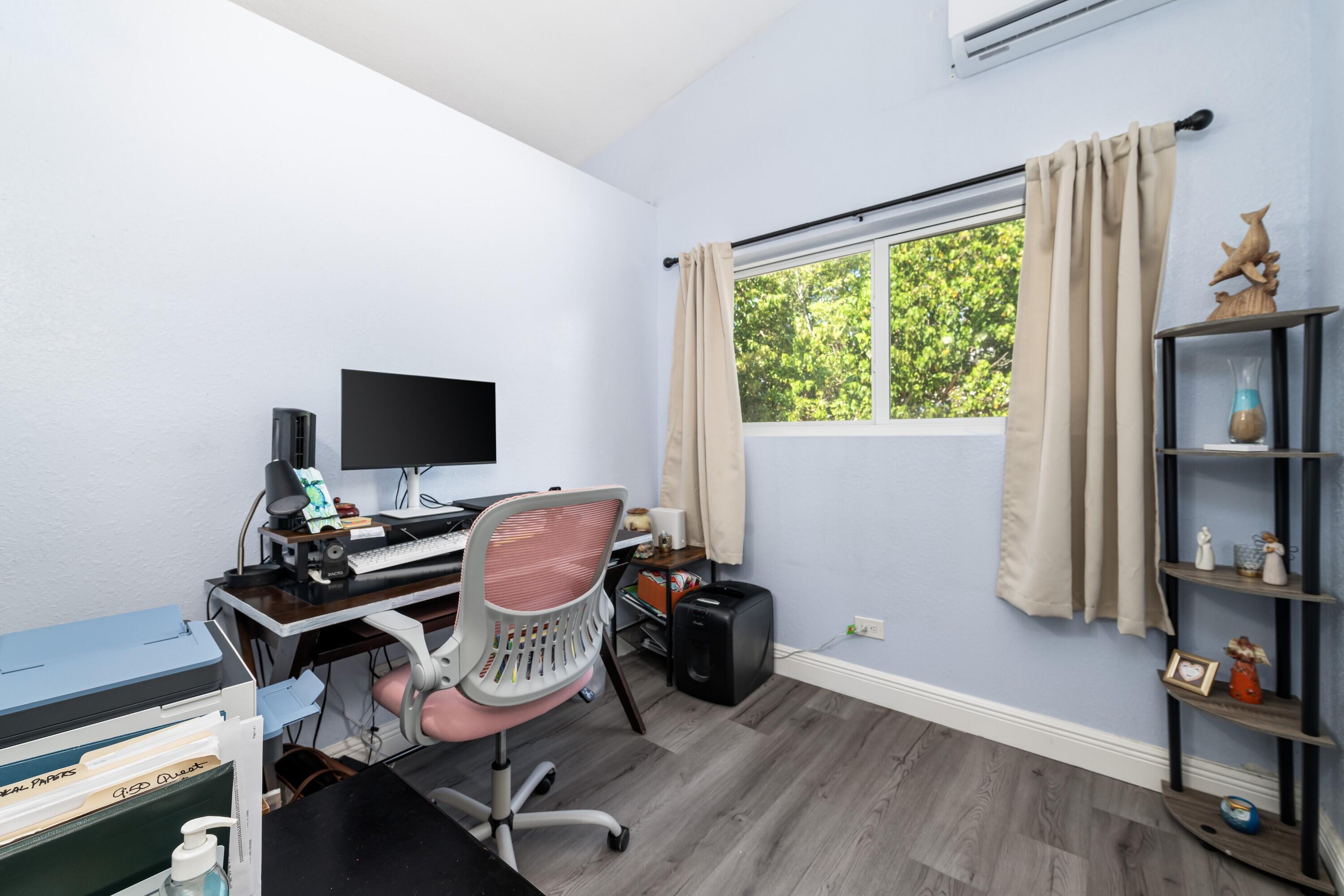 423 80th Street Marathon, FL 33050 - Photo 25 of 39 a view of a workspace with furniture and a window