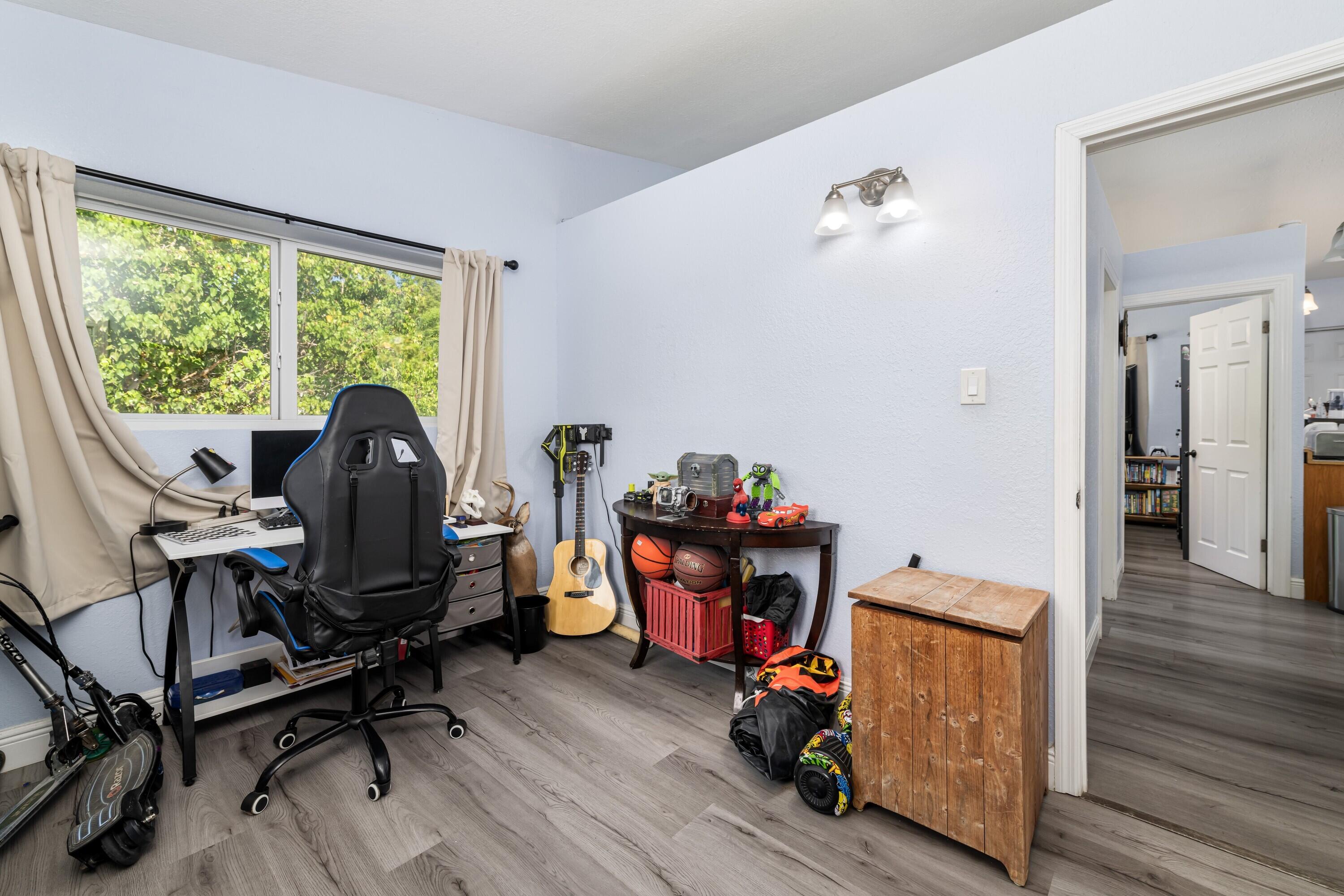 423 80th Street Marathon, FL 33050 - Photo 27 of 39 a view of a workspace with wooden floor and a window