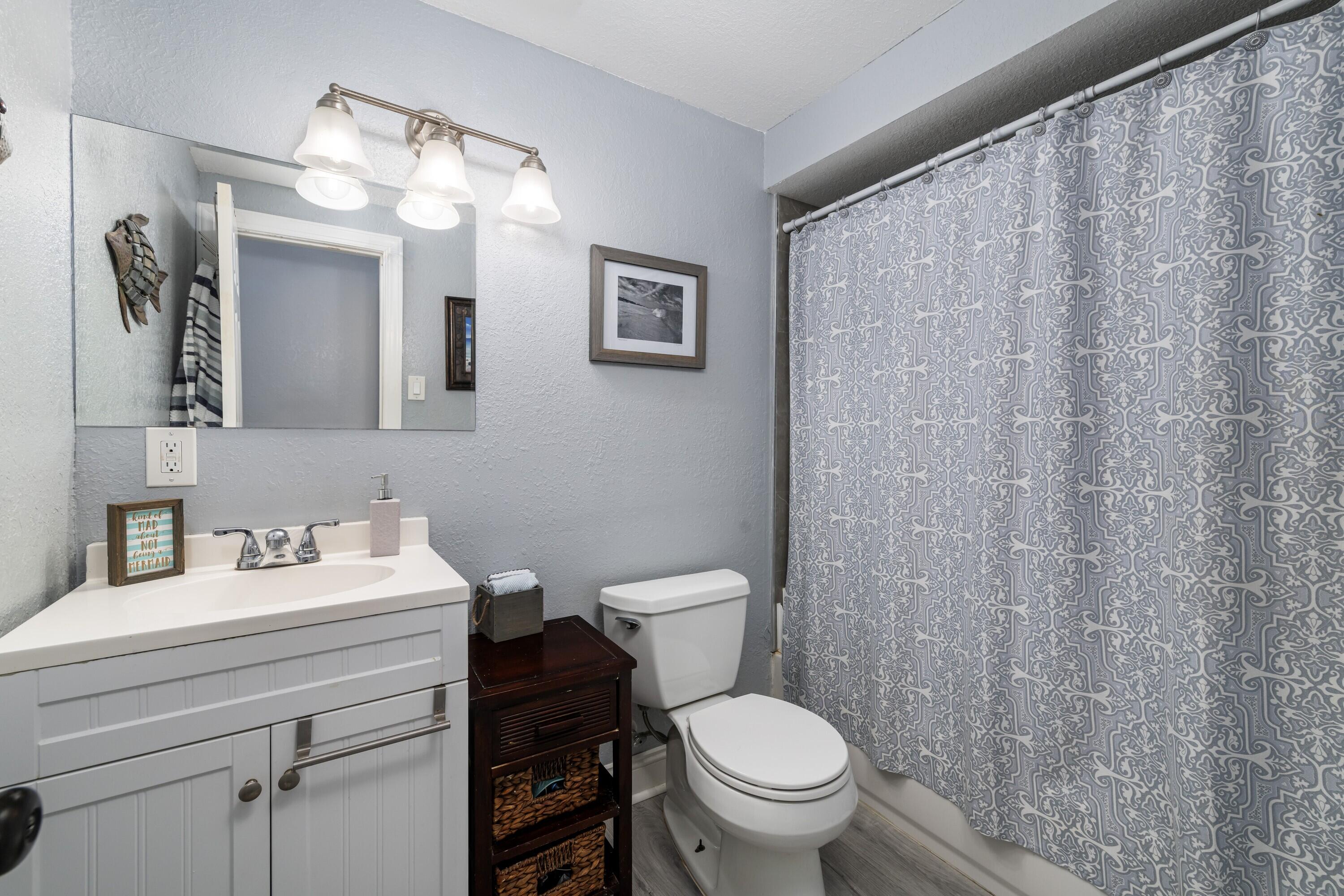 423 80th Street Marathon, FL 33050 - Photo 29 of 39 a bathroom with a toilet sink vanity and mirror
