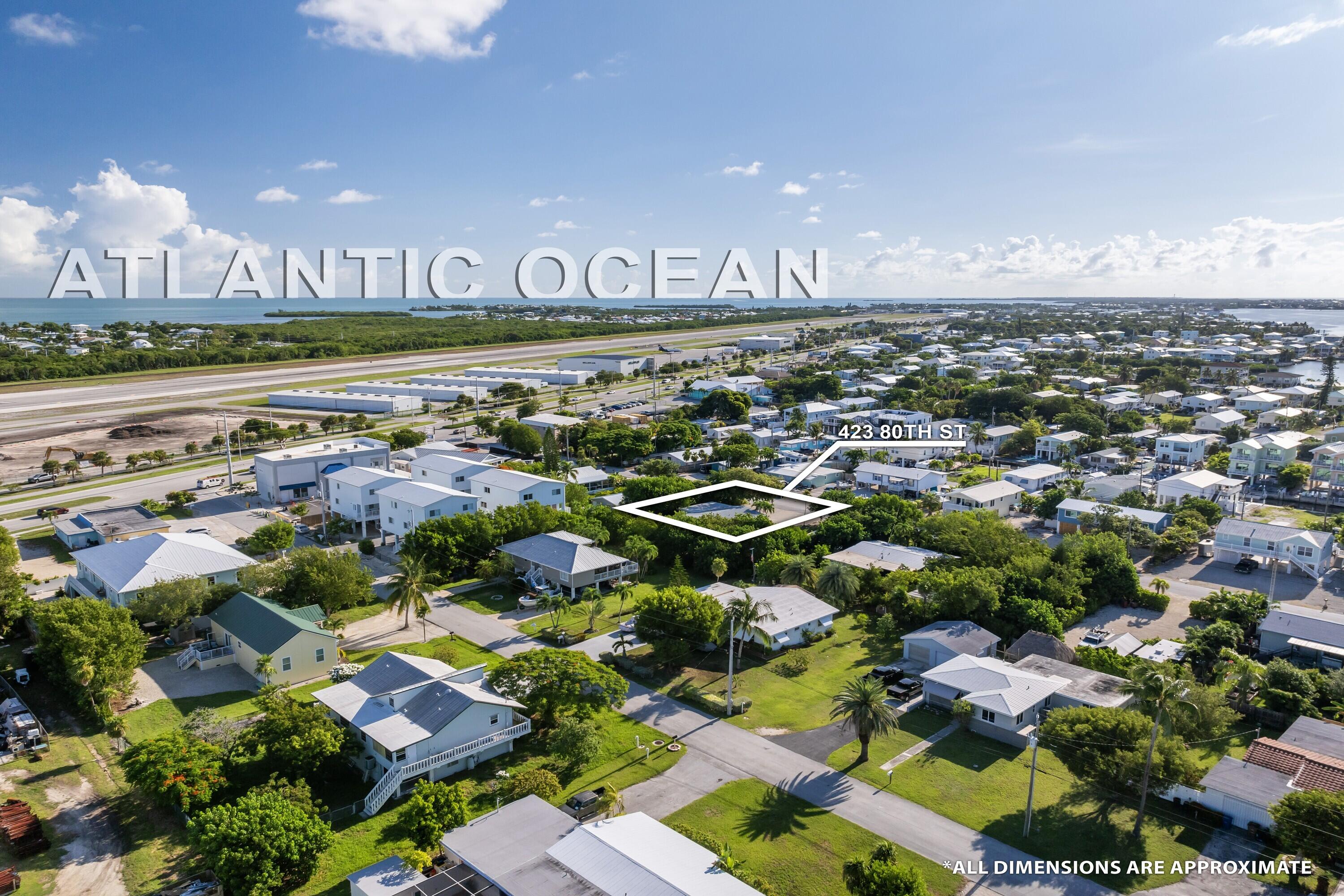 423 80th Street Marathon, FL 33050 - Photo 36 of 39 an aerial view of residential building and car parked