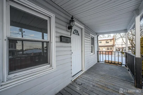 a view of a house with wooden deck