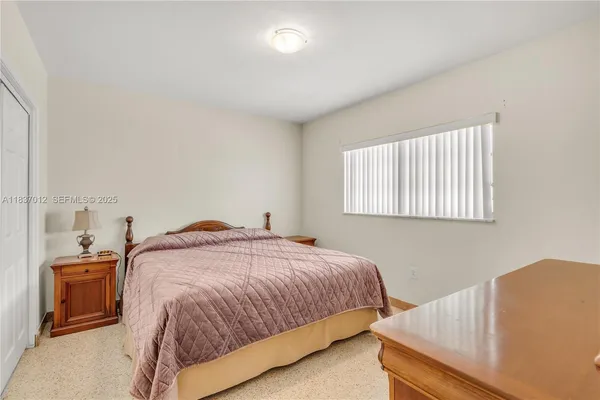 a bedroom with a bed and a cabinets