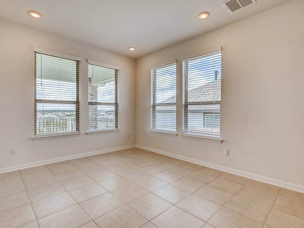 334 Pecos River Crossing Dripping Springs, TX 78620 - Photo 11 of 28 an empty room with windows