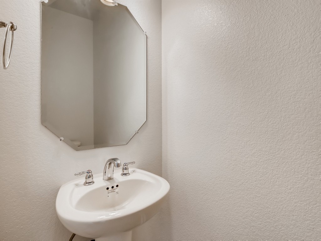 334 Pecos River Crossing Dripping Springs, TX 78620 - Photo 12 of 28 a bathroom with a sink and a mirror