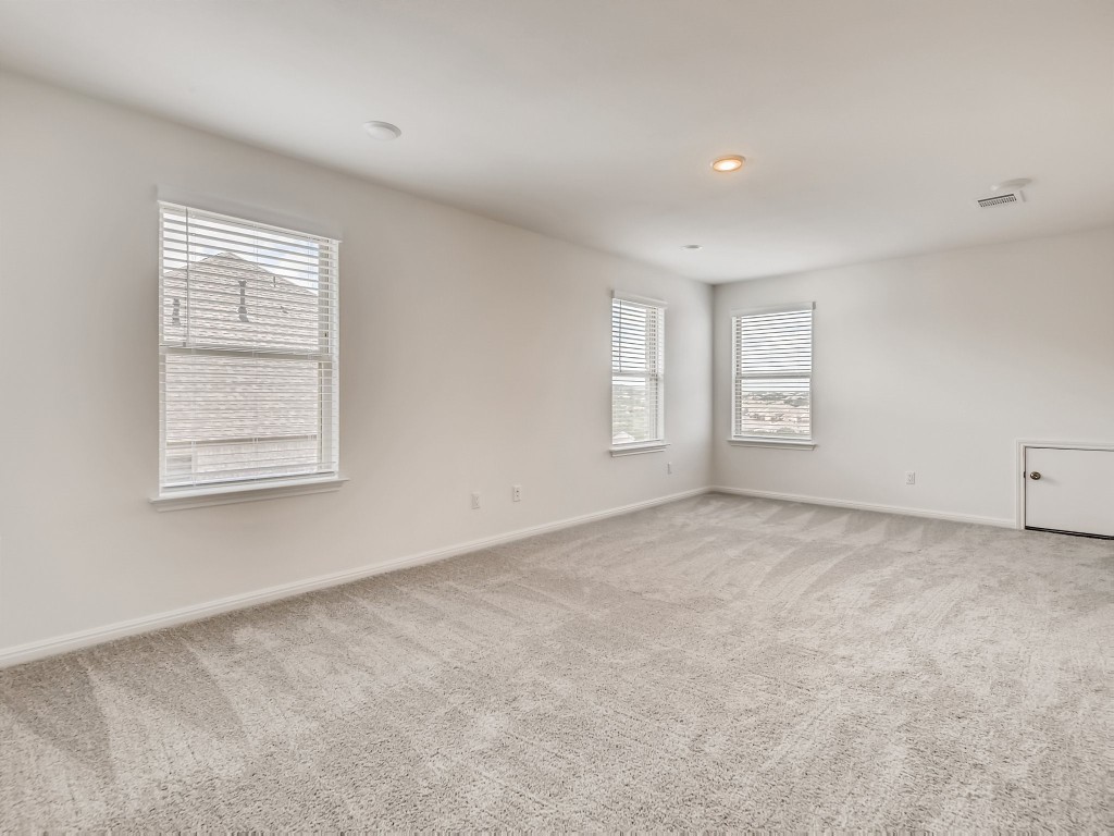 334 Pecos River Crossing Dripping Springs, TX 78620 - Photo 17 of 28 an empty room with windows