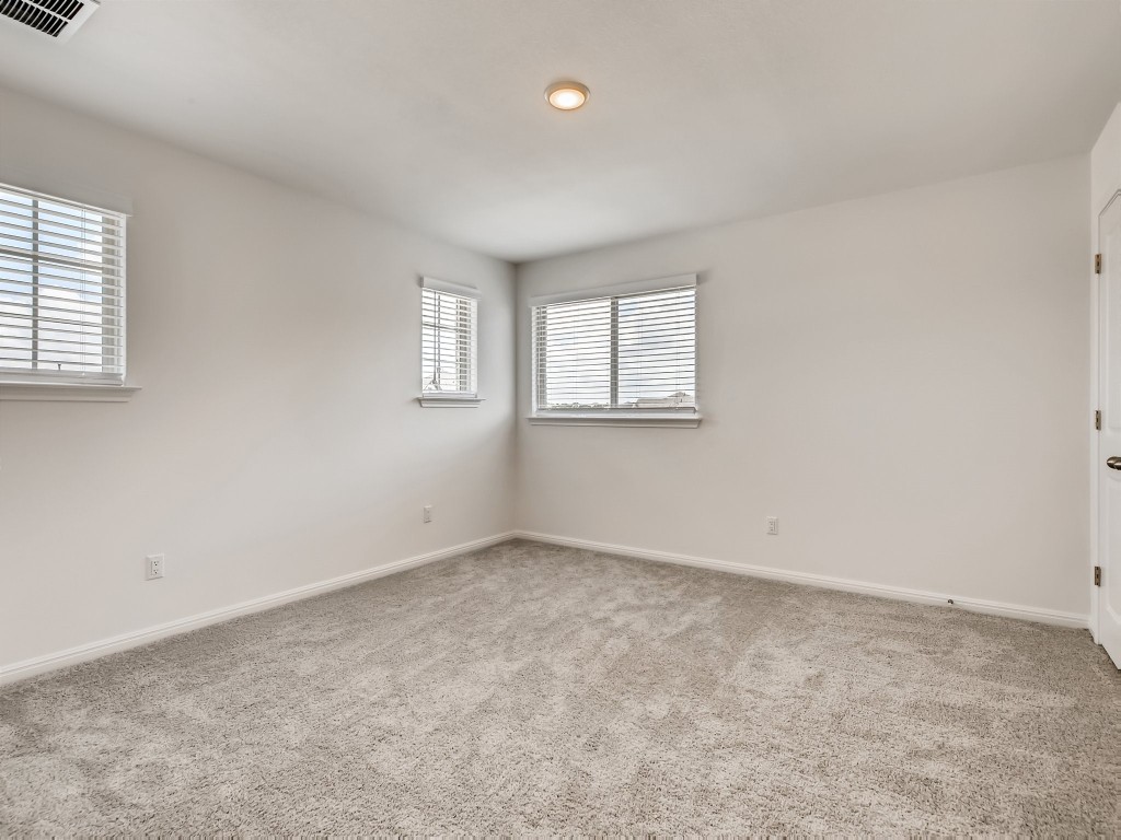 334 Pecos River Crossing Dripping Springs, TX 78620 - Photo 18 of 28 an empty room with windows