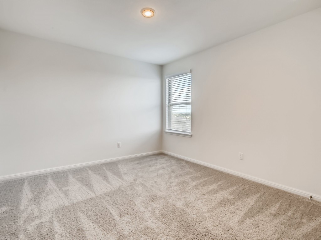 334 Pecos River Crossing Dripping Springs, TX 78620 - Photo 21 of 28 an empty room with windows