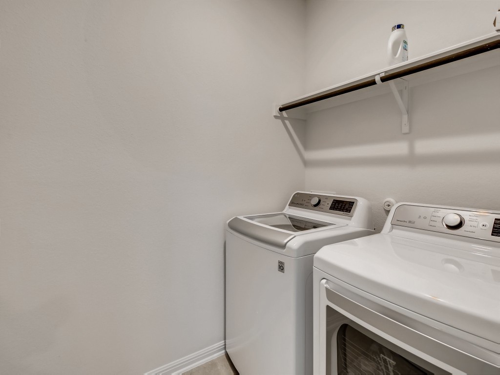 334 Pecos River Crossing Dripping Springs, TX 78620 - Photo 23 of 28 a utility room with dryer and washer