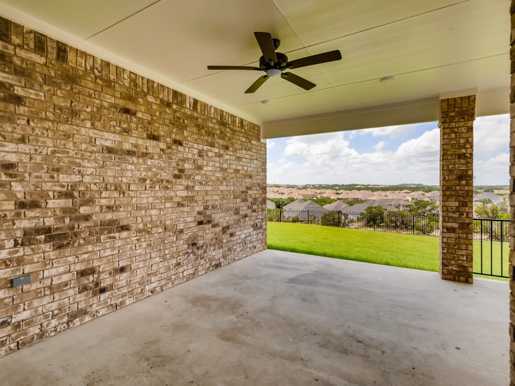 334 Pecos River Crossing Dripping Springs, TX 78620 - Photo 24 of 28 a view of a yard and entertaining space in front of a house