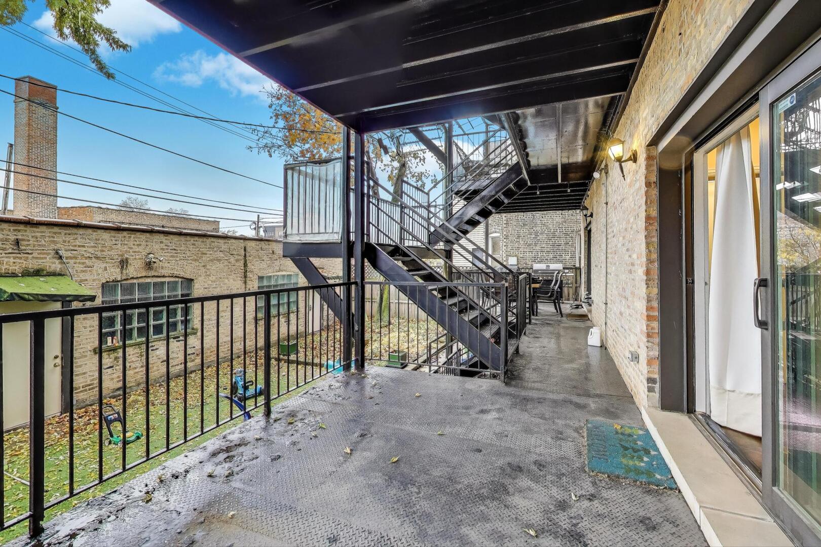 4432 North Dover Street, Unit 1S Chicago, IL 60640 - Photo 20 of 30 a view of a porch with wooden floor