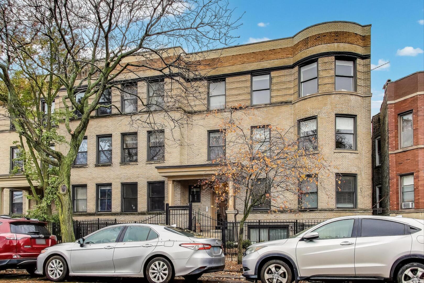 4432 North Dover Street, Unit 1S Chicago, IL 60640 - Photo 2 of 30 a front view of a building with parking space