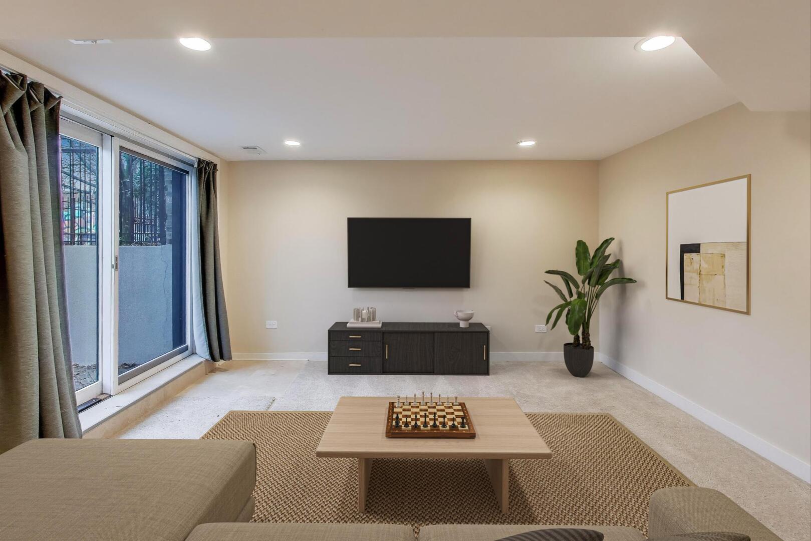 4432 North Dover Street, Unit 1S Chicago, IL 60640 - Photo 21 of 30 a living room with furniture and a flat screen tv