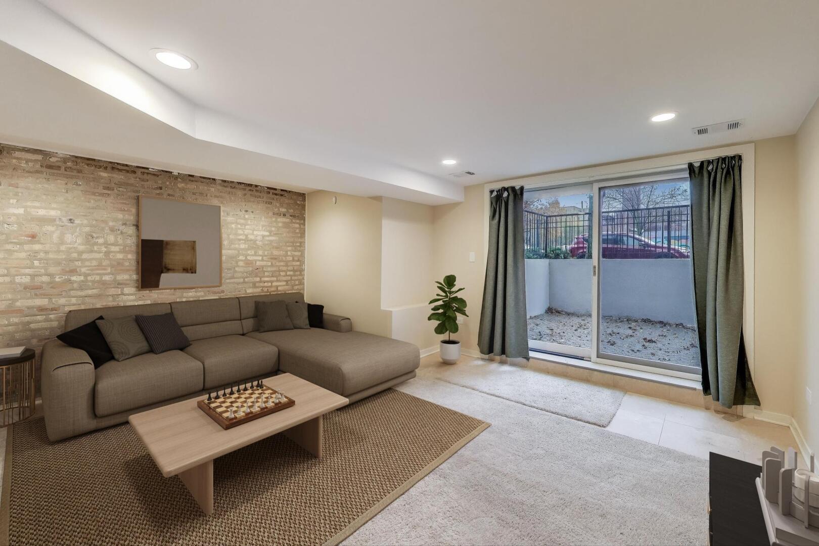 4432 North Dover Street, Unit 1S Chicago, IL 60640 - Photo 22 of 30 a living room with furniture and a glass door