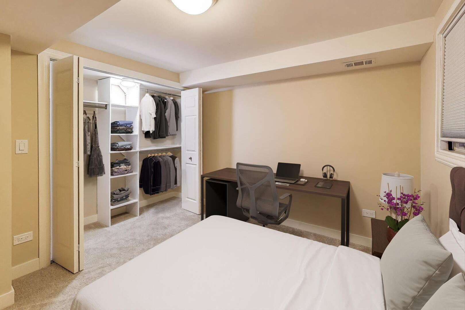 4432 North Dover Street, Unit 1S Chicago, IL 60640 - Photo 24 of 30 a bed room with a bed and a television