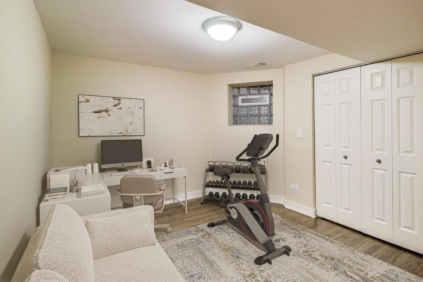 4432 North Dover Street, Unit 1S Chicago, IL 60640 - Photo 26 of 30 a work room with furniture a rug and white walls