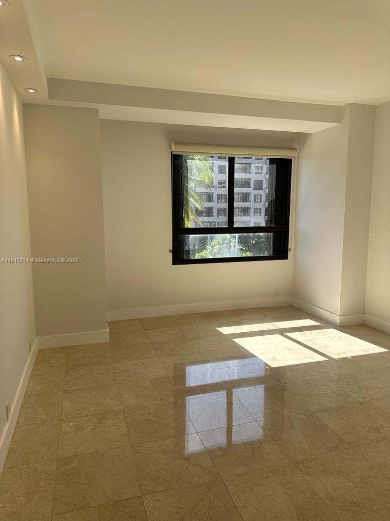 251 Crandon Boulevard, Unit 430 Key Biscayne, FL 33149 - Photo 12 of 19 a view of an empty room with a window