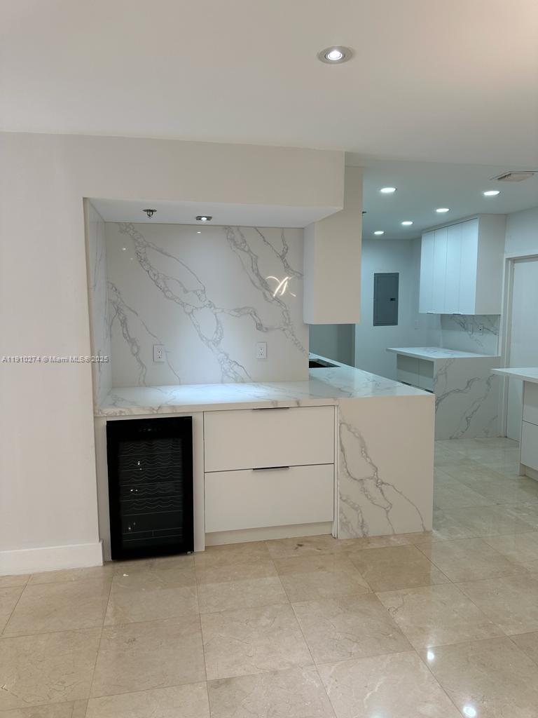 251 Crandon Boulevard, Unit 430 Key Biscayne, FL 33149 - Photo 7 of 19 a view of an empty room with a fireplace