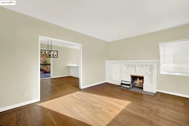 an empty room with wooden floor