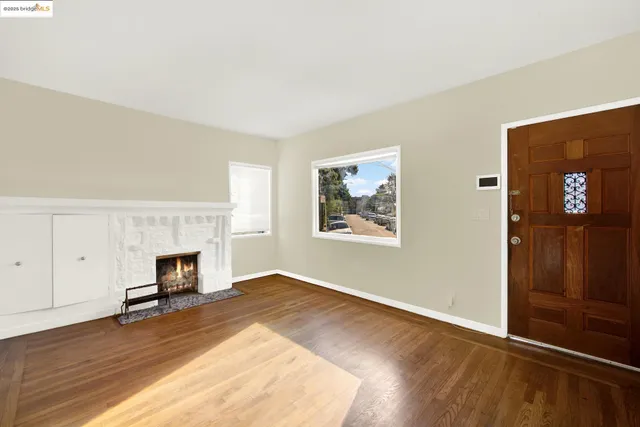a view of a room with wooden floor and closet