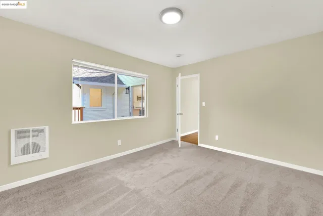 a view of a balcony with wooden floor and fence