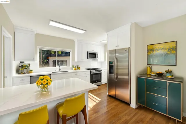 a kitchen with a refrigerator and a sink