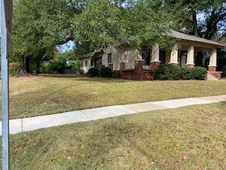 2501 18th Avenue, Unit B Columbus, GA 31901 - Photo 1 of 3 a front view of a house with a yard and trees