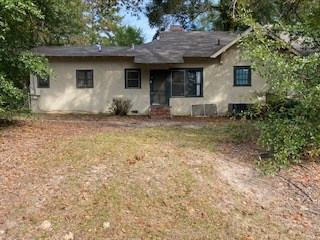 2501 18th Avenue, Unit B Columbus, GA 31901 - Photo 2 of 3 a house with trees in the background