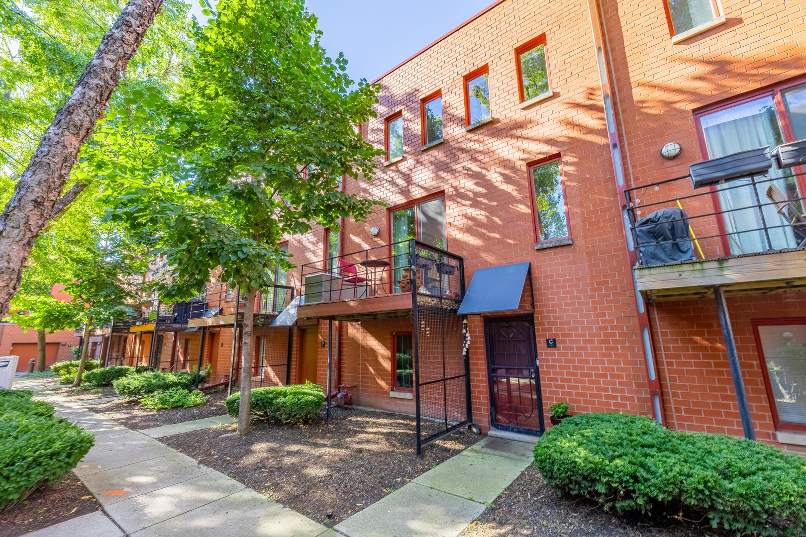 a view of a brick building with many windows