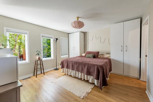 a bedroom with a bed and a table