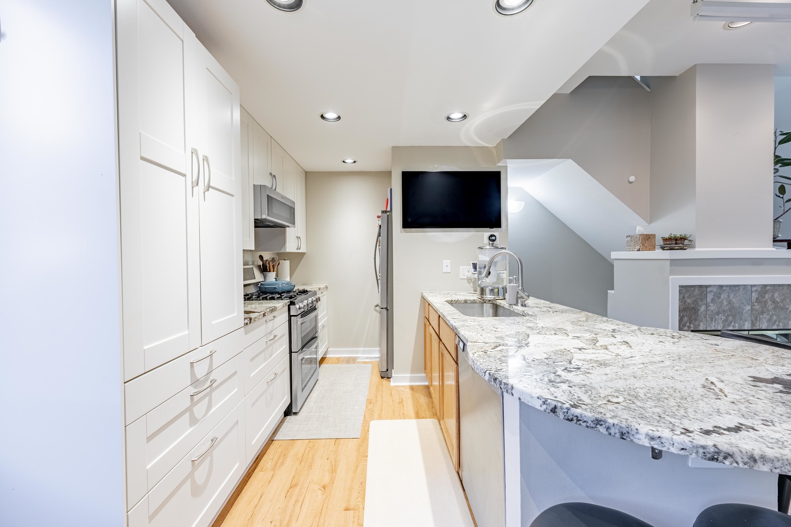 1200 South Federal Street, Unit C Chicago, IL 60605 - Photo 10 of 20 a large kitchen with kitchen island a sink appliances and cabinets