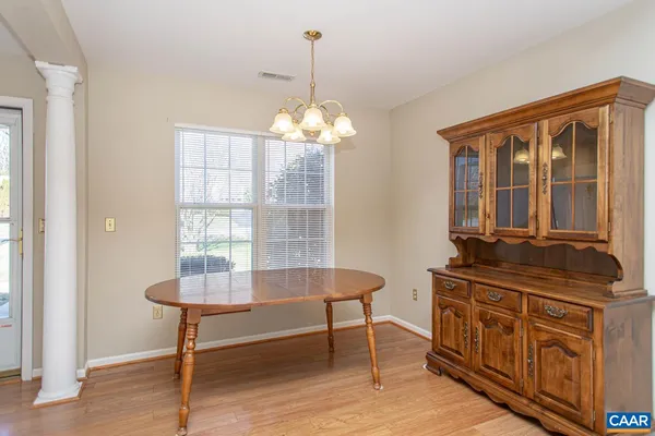 a kitchen with granite countertop a sink a stove and cabinets