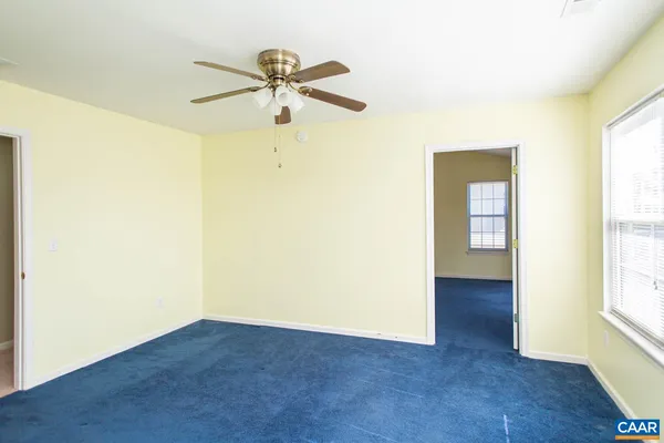a view of a bathroom with a sink and a mirror