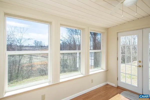 a view of a room with a large window