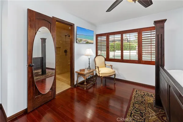 a view of a livingroom with furniture and a window