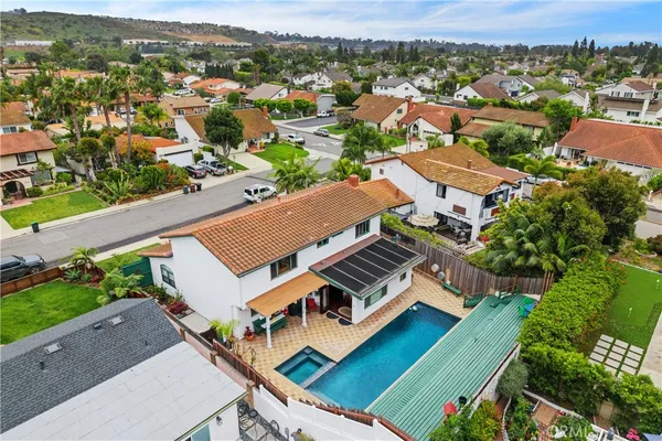 a view of a backyard with sitting area