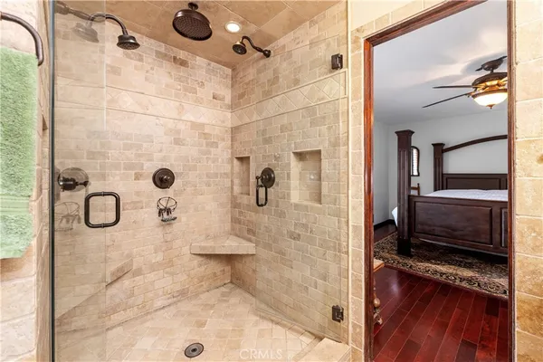 a view of a house with pool and chairs