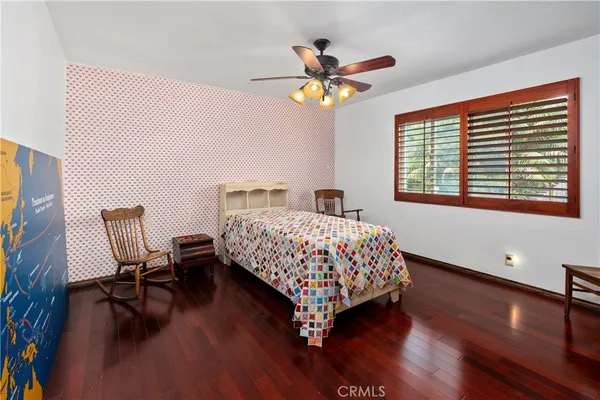 a view of a house with pool and chairs