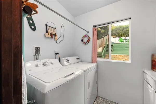 a vase of flowers sitting on a floor