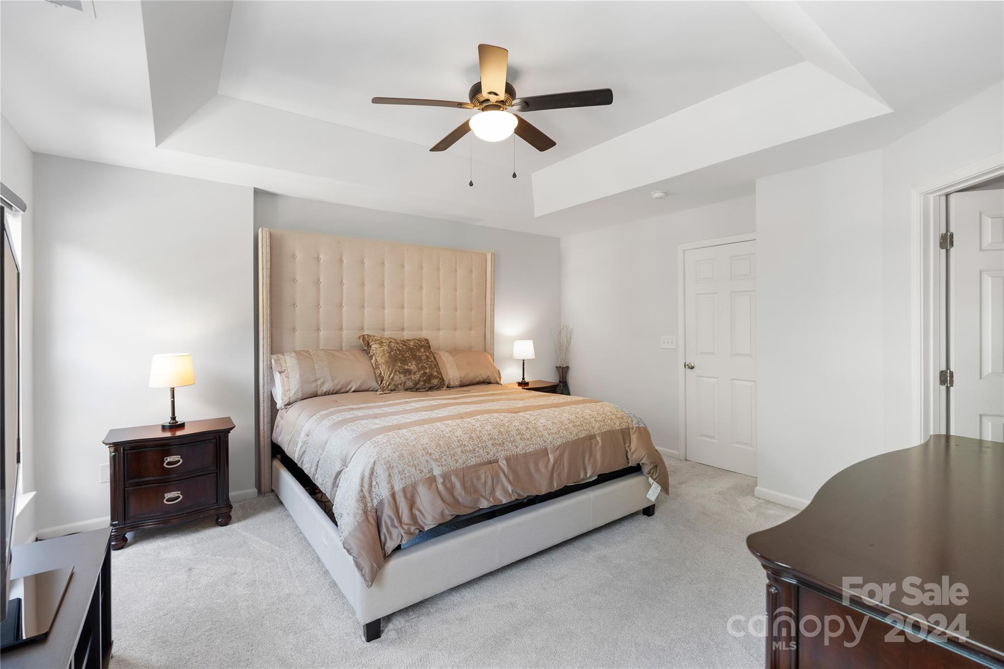 621 Atherton Way Rock Hill, SC 29730 - Photo 20 of 33 a bedroom with a bed and a chandelier